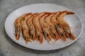 Traditional gambas a la plancha or grilled shrimp tapas being cooked on a hot plate in Madrid, Spain Royalty Free Stock Photo