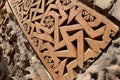 Traditional geometrical muslim ornaments with fertility swastika symbol on the medieval Karakhanid`s tomb in Uzgen,Osh Region, Kyr