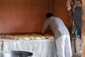 Traditional Georgian bakery shop. A male cook bakes bread.