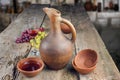 Traditional Georgian wine jug and set of clay cups Royalty Free Stock Photo