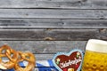 Traditional german bavarian festival Oktoberfest with pretzels, beer and gingerbread heart