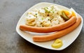 Traditional German bockwurst with potato salad Royalty Free Stock Photo