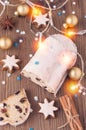 Traditional german christmas cake stollen with cookies and decoration on wooden table