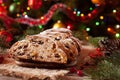 Traditional German Christmas cake Stollen with Marzipan, Nuts and Berries. Celebration decorations.