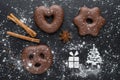 Traditional german christmas chocolate gingerbread lebkuchen with spices and flour like christmas tree, gift and snow