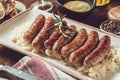 German Grilled Sausages with Cabbage Salad, Mustard and Beer Royalty Free Stock Photo