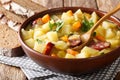 Traditional German kartoffelsuppe potato soup with sausages in a Royalty Free Stock Photo