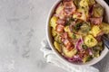 Traditional German potato salad with cucumber, onion and bacon prepared in Swabian-Style Southern Germany. Royalty Free Stock Photo