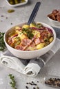 Traditional German potato salad with cucumber, onion and bacon prepared in Swabian-Style Southern Germany. Royalty Free Stock Photo