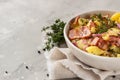 Traditional German potato salad with cucumber, onion and bacon prepared in Swabian-Style Southern Germany. Royalty Free Stock Photo