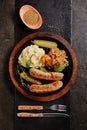 Traditional German Sausages with Mashed Potato and Sauerkraut Royalty Free Stock Photo