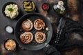 Traditional German Sausages with Mashed Potatoes and Sauerkraut in cast iron frying pan  on old dark rustic background  top view Royalty Free Stock Photo