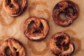 Traditional German Savory Lye Pretzel with Salt on Piece of Parchment Paper. Royalty Free Stock Photo