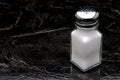 A traditional glass salt shaker Royalty Free Stock Photo