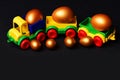 Traditional golden eggs in plastic colorful car toy or locomotive Royalty Free Stock Photo