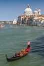 Traditional gondola on Canal Grande with Basilica di Santa Maria della Salute in the background, Venice, Italy Royalty Free Stock Photo