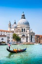 Traditional Gondola on Canal Grande with Basilica di Santa Maria della Salute, Venice, Italy Royalty Free Stock Photo