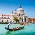 Traditional Gondola on Canal Grande with Basilica di Santa Maria della Salute, Venice, Italy Royalty Free Stock Photo