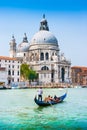 Traditional Gondola on Canal Grande with Basilica di Santa Maria della Salute in Venice, Italy Royalty Free Stock Photo