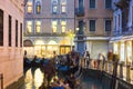 Traditional gondola ride at night in venice Royalty Free Stock Photo