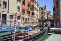 Traditional gondola in venetian water canal in Venice, Italy