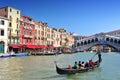 Traditional gondolas on Canal Grande at famous Rialto bridge. Venice Italy. Royalty Free Stock Photo