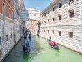 Traditional gondolas floating on canal in Venice. Royalty Free Stock Photo