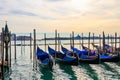 Traditional Gondolas moored on pier in the Grand Canal in Venice, Italy Royalty Free Stock Photo