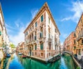 Traditional Gondolas on narrow canal between colorful houses, Venice, Italy Royalty Free Stock Photo