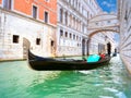 Traditional Gondolas passing over Bridge of Sighs in Venice Royalty Free Stock Photo
