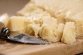 Traditional grana padano italian cheese on olive board