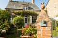 Traditional granite house and beautiful courtyard in Barfleur. Normandy, France Royalty Free Stock Photo