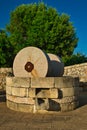 Traditional granite mill for pressing olives. Typical Salento farmhouse, Puglia Italy.