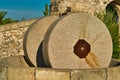 Traditional granite mill for pressing olives. Typical Salento farmhouse, Puglia Italy.