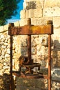 Traditional granite mill for pressing olives. Typical Salento farmhouse, Puglia Italy.