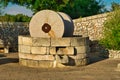 Traditional granite mill for pressing olives. Typical Salento farmhouse, Puglia Italy.