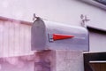 Traditional gray mailbox stands on a stone fence of a private house, communication and message concept, postal service of a