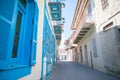 Traditional greek architecture with blue doors in the city of Pyrgos on the island of Santorini, Greece, Europe. Royalty Free Stock Photo