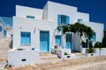 Traditional greek architecture houses painted white with blue doors and window shutters