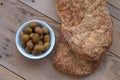 Traditional greek bread ( lagana ) ,olives ,seafood , greek taramas .