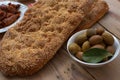 Traditional greek bread ( lagana ) ,olives ,seafood , greek taramas .