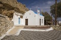 Traditional Greek chapel on the hill. A small Greek church by the sea. Royalty Free Stock Photo