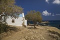 Traditional Greek chapel on the hill. A small Greek church by the sea. Royalty Free Stock Photo