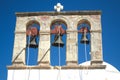 Traditional Greek church bell tower at the island of Patmos with a background of a clear blue sky. Royalty Free Stock Photo