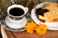 Traditional Greek coffee and pound cake for breakfast and two buds, flowers