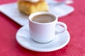 Traditional greek coffee served in white coffee set in cafe Royalty Free Stock Photo