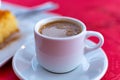 Traditional greek coffee served in white coffee set in cafe Royalty Free Stock Photo