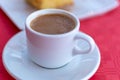 Traditional greek coffee served in white coffee set in cafe Royalty Free Stock Photo