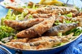 Traditional Greek crispy fried sardines in batter