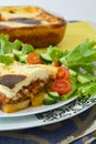 Traditional Greek dish with aubergines,potatoes,minced meat baked in white sauce with cheese Royalty Free Stock Photo